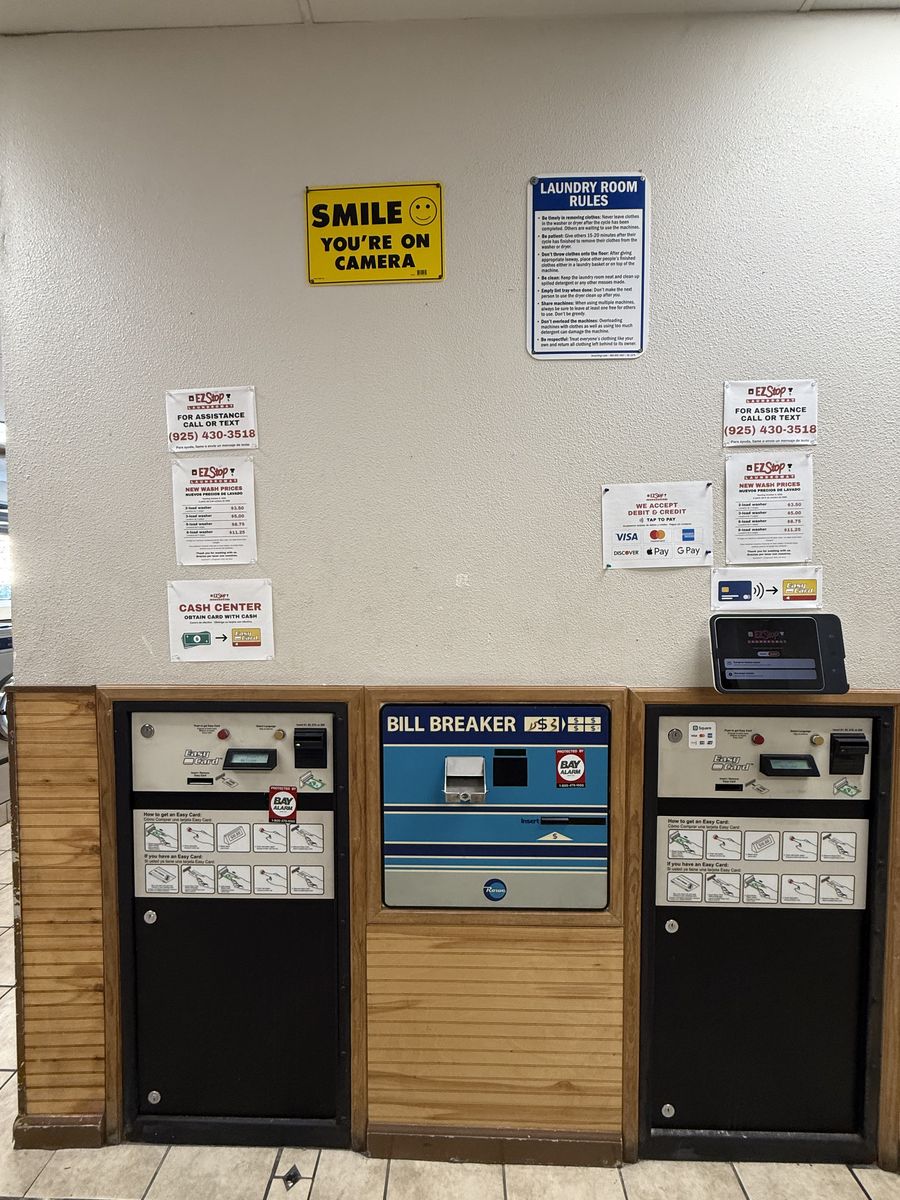 Payment center at EZ Stop with card readers and a bill breaker